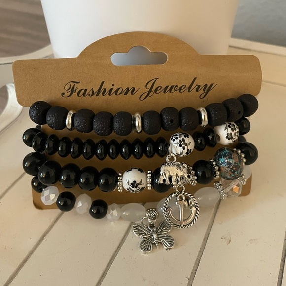 Jewelry - 4 pack fashion bracelets with Anchor, Elephant and Butterfly Charm NWT